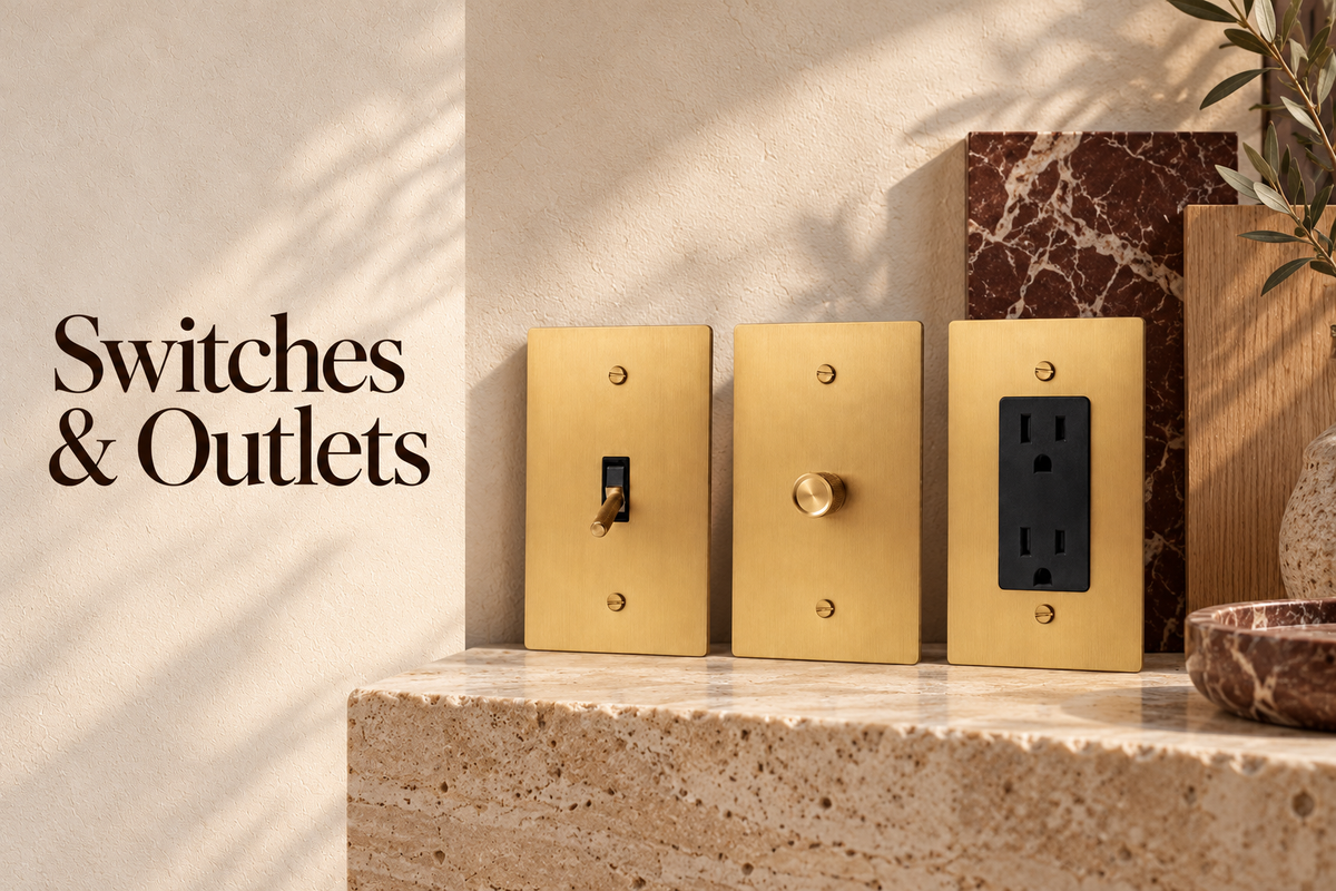 Brass toggle, rotary dimmer and duplex outlet with stone and oak samples and Switches & Outlets title; AI-styled illustration | CARRA HOME