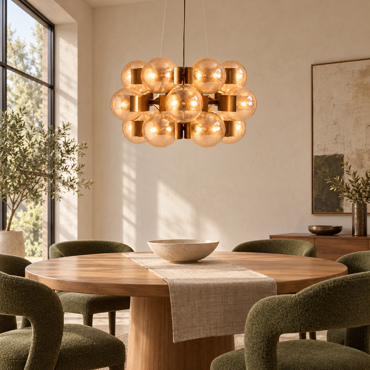 Allis chandelier above a round dining table | CARRA HOME