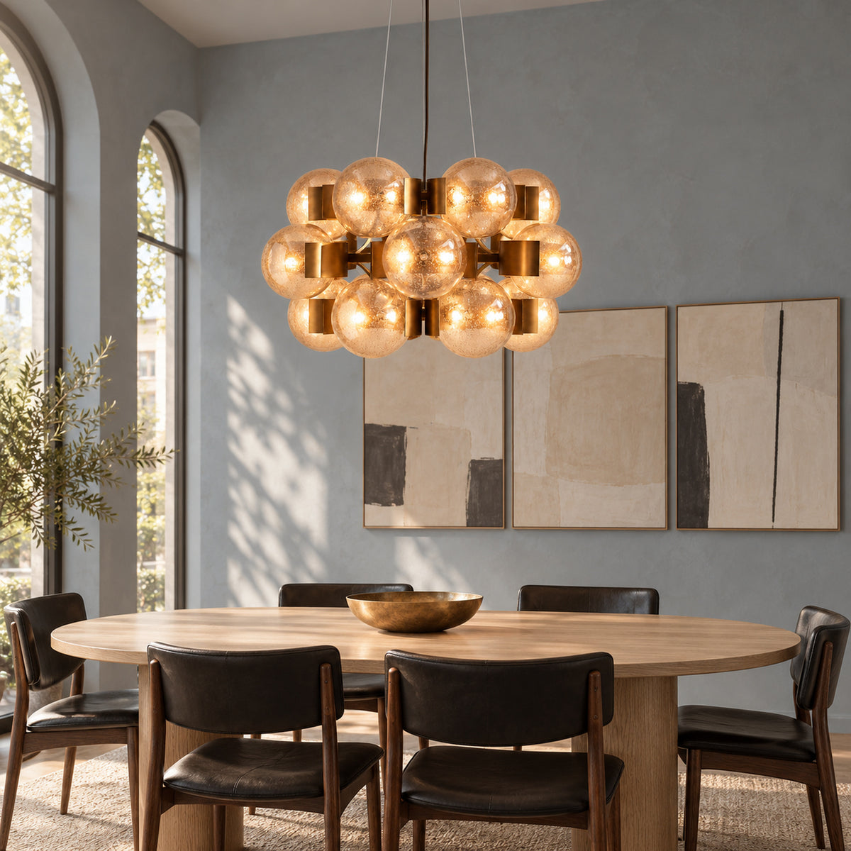 Allis chandelier above an oval dining table | CARRA HOME