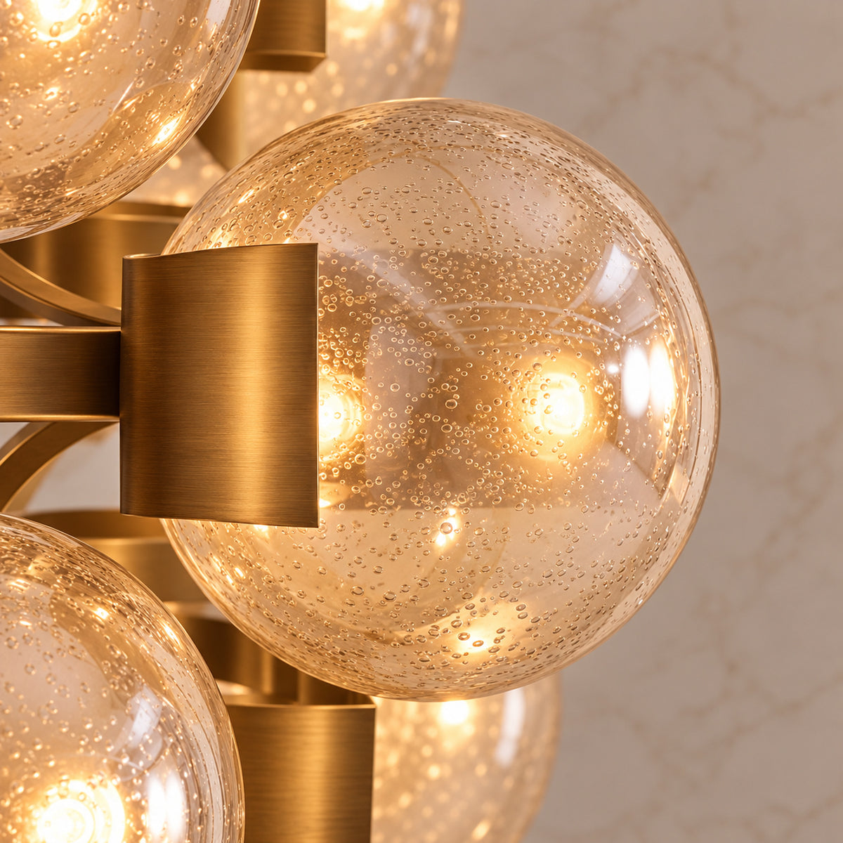 Allis seeded glass globe and antique brass surround detail | CARRA HOME