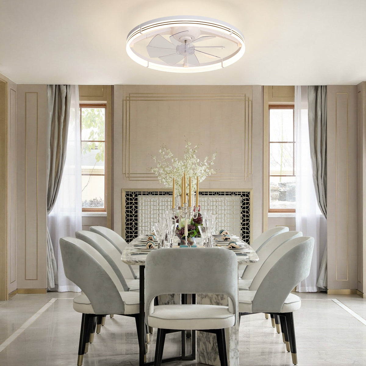 White foldable ceiling fan in modern luxury dining room — marble round table, cream upholstered chairs, black gold legs, wainscoting walls, warm LED glow | CARRA HOME