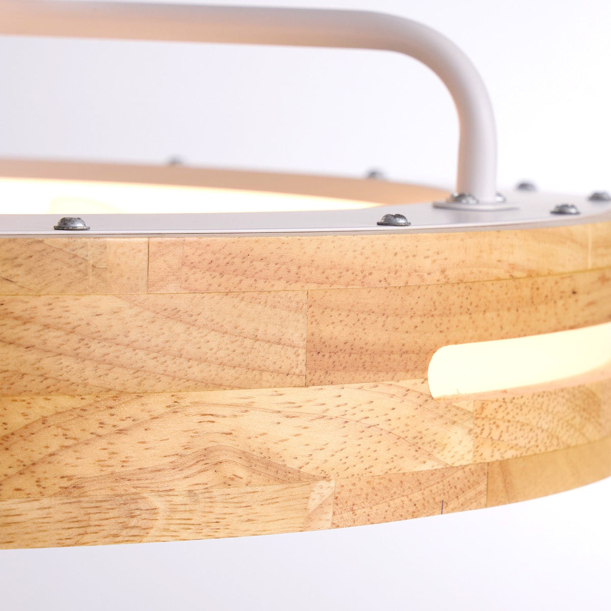 Close-up of Aeria Ceiling Fan — natural wood grain housing, white metal frame, silver hardware screws, premium craftsmanship and textured finish | CARRA HOME
