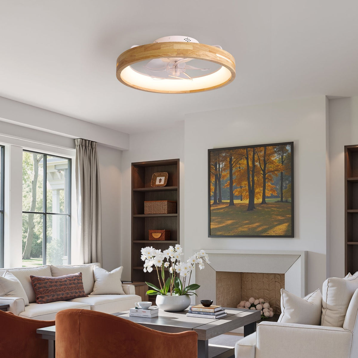 Aeria Flush Mount Ceiling Fan in cozy living room — white sofa, fireplace, bookshelf, autumn wall art, soft natural light through windows | CARRA HOME