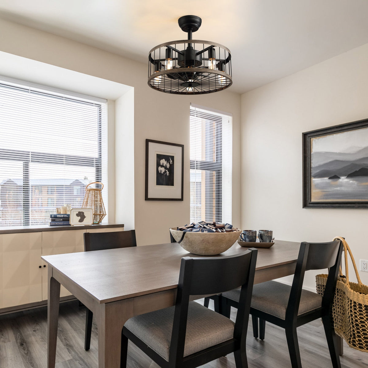 Aerozen drum caged fan in farmhouse dining room — wooden table, patterned chairs, black frame windows, warm Edison bulb glow, perfect for family meals | CARRA HOME