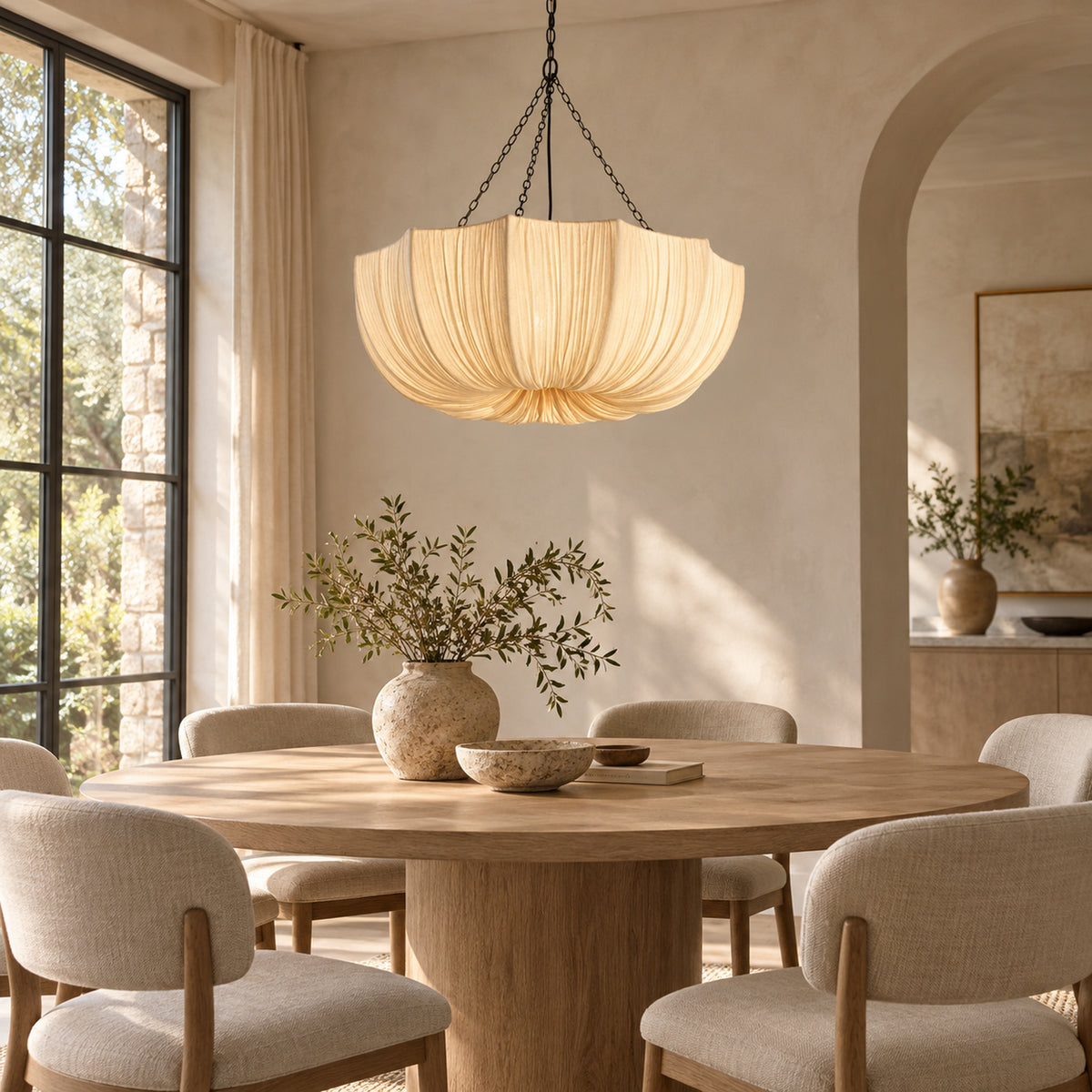 Aldwin 80 cm cotton pleated dome pendant light above a round dining table in a warm contemporary dining room | CARRA HOME
