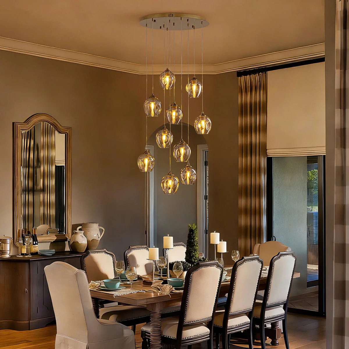 aura-luxury-glass-chandelier-hanging-above-a-dining-table-Carra Home-lighting
