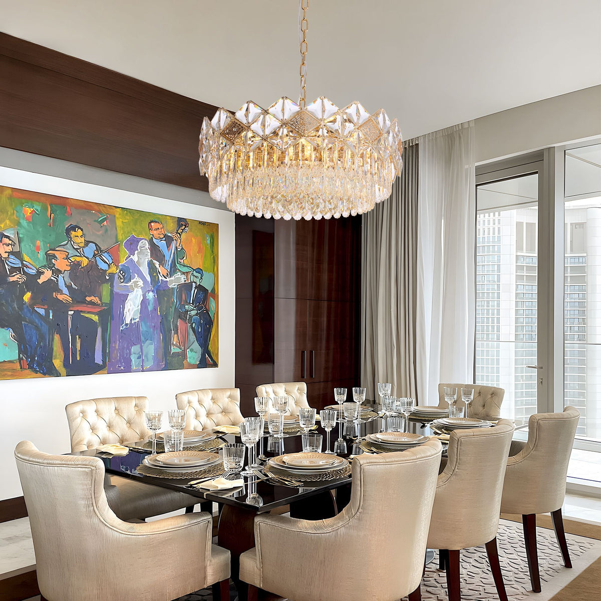 Aureme Chandelier above a formal dining table — dark wood table, cream upholstered chairs, colorful artwork, and sophisticated evening ambiance | Carra Home