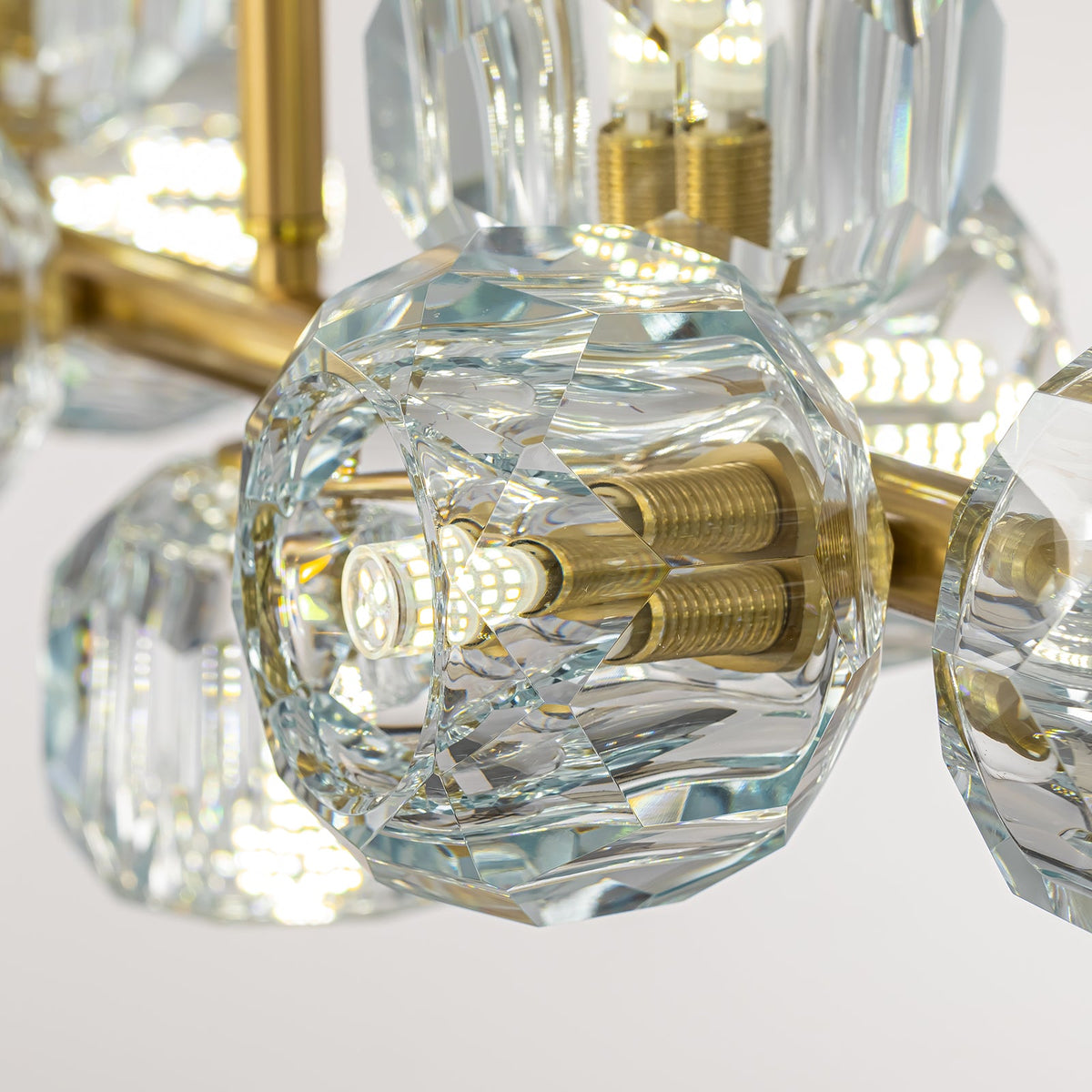 aurielle-contemporary-gold-crystal-linear-multi-head-chandelier-details-of-lights-with-white-background-CH618-A-Carra Home-20260427