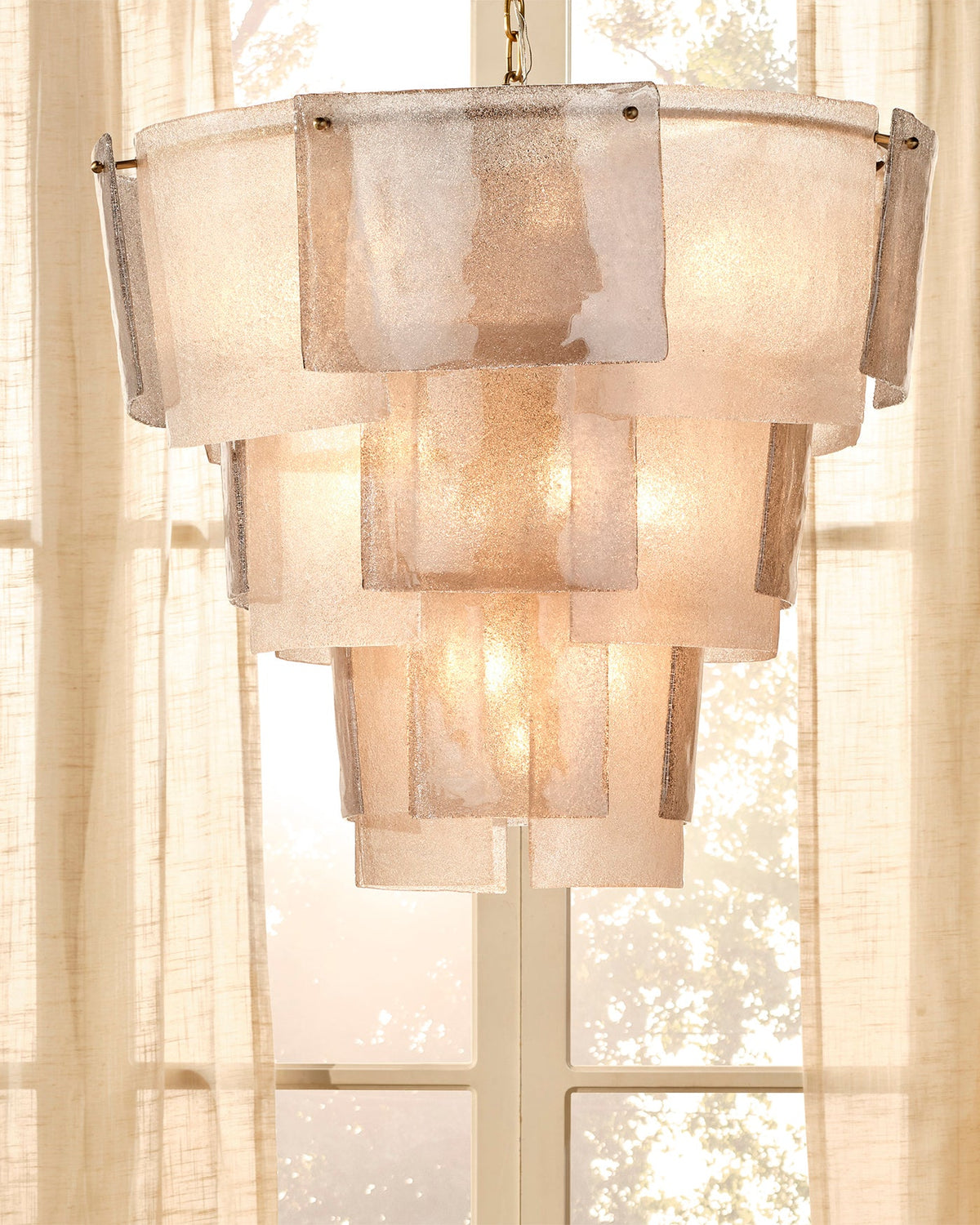 Aurora seeded glass tiered chandelier in a refined interior | CARRA HOME