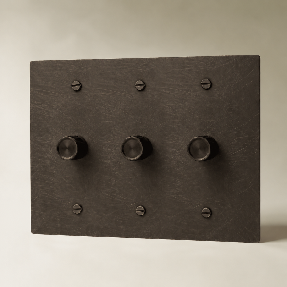 Brass Rotary Dimmer Switch, Bronze with Patina 3 Gang product view — seamless faceplate | CARRA HOME