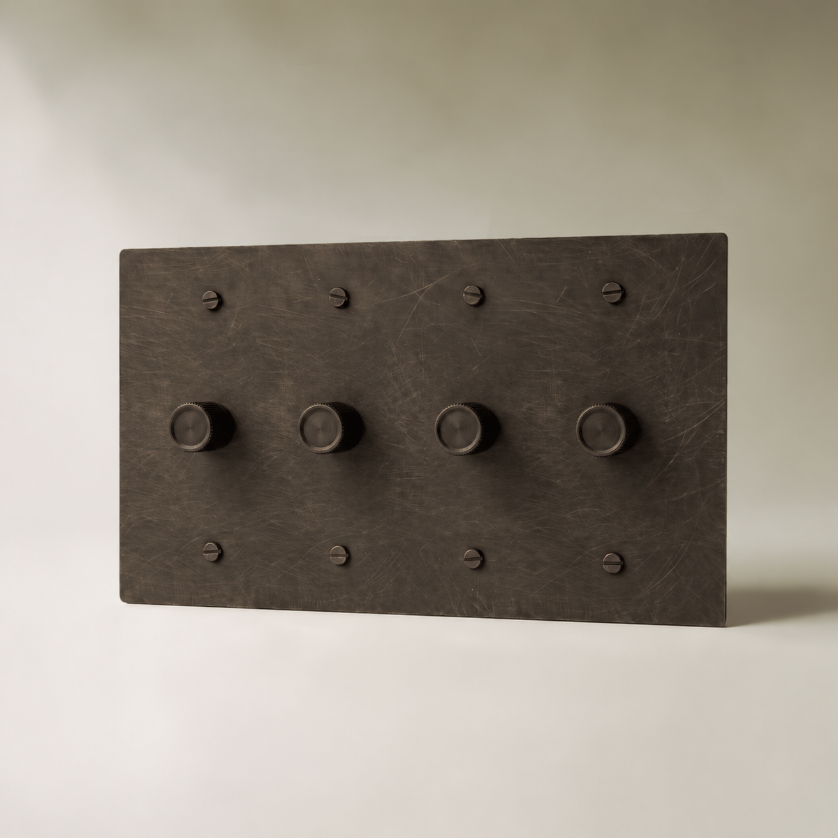 Brass Rotary Dimmer Switch, Bronze with Patina 4 Gang product view — seamless faceplate | CARRA HOME