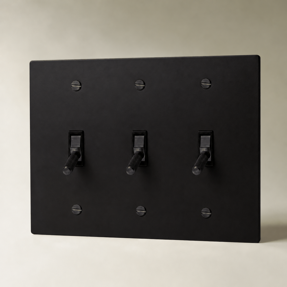 Brass Toggle Switch, Night Black 3 Gang product view — seamless faceplate | CARRA HOME