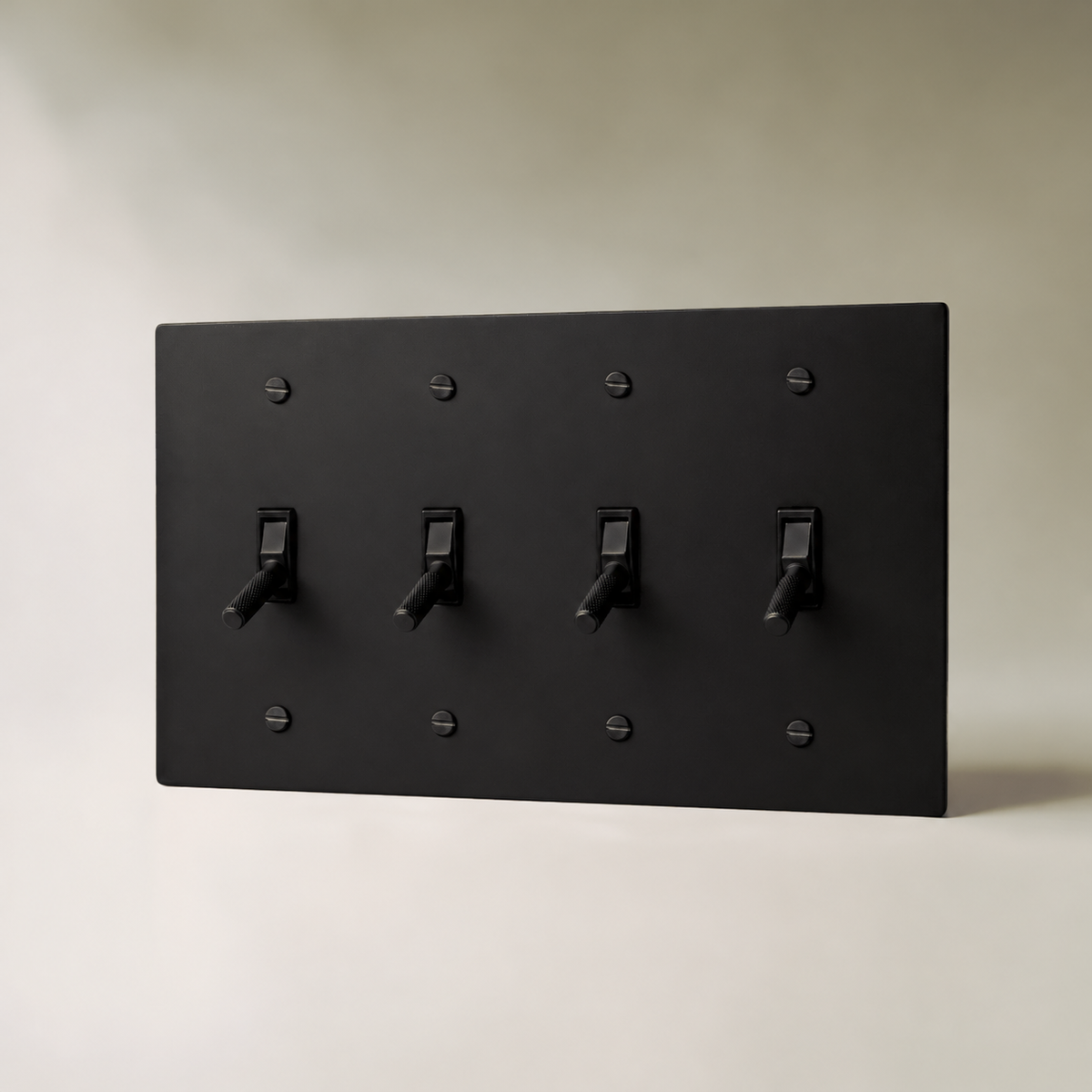 Brass Toggle Switch, Night Black 4 Gang product view — seamless faceplate | CARRA HOME