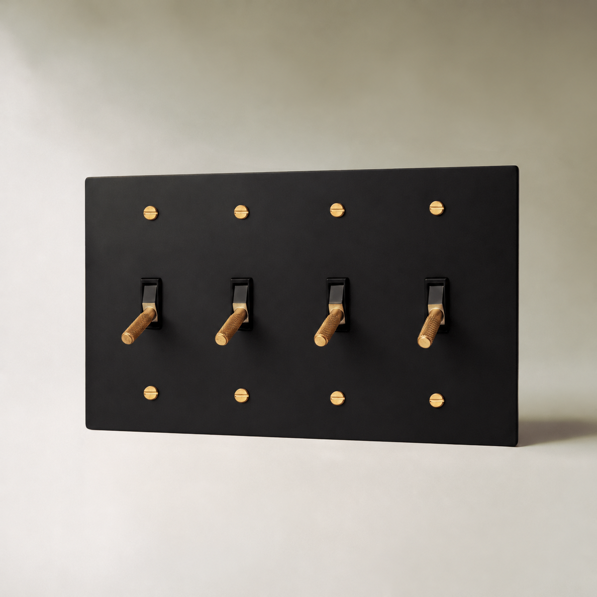Brass Toggle Switch, Night Black with Brass 4 Gang product view — seamless faceplate | CARRA HOME