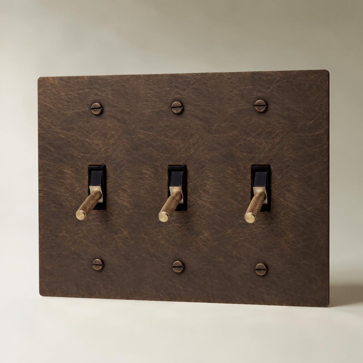 Brass Toggle Switch, Vintage Brass with Patina 3 Gang product view — seamless faceplate | CARRA HOME