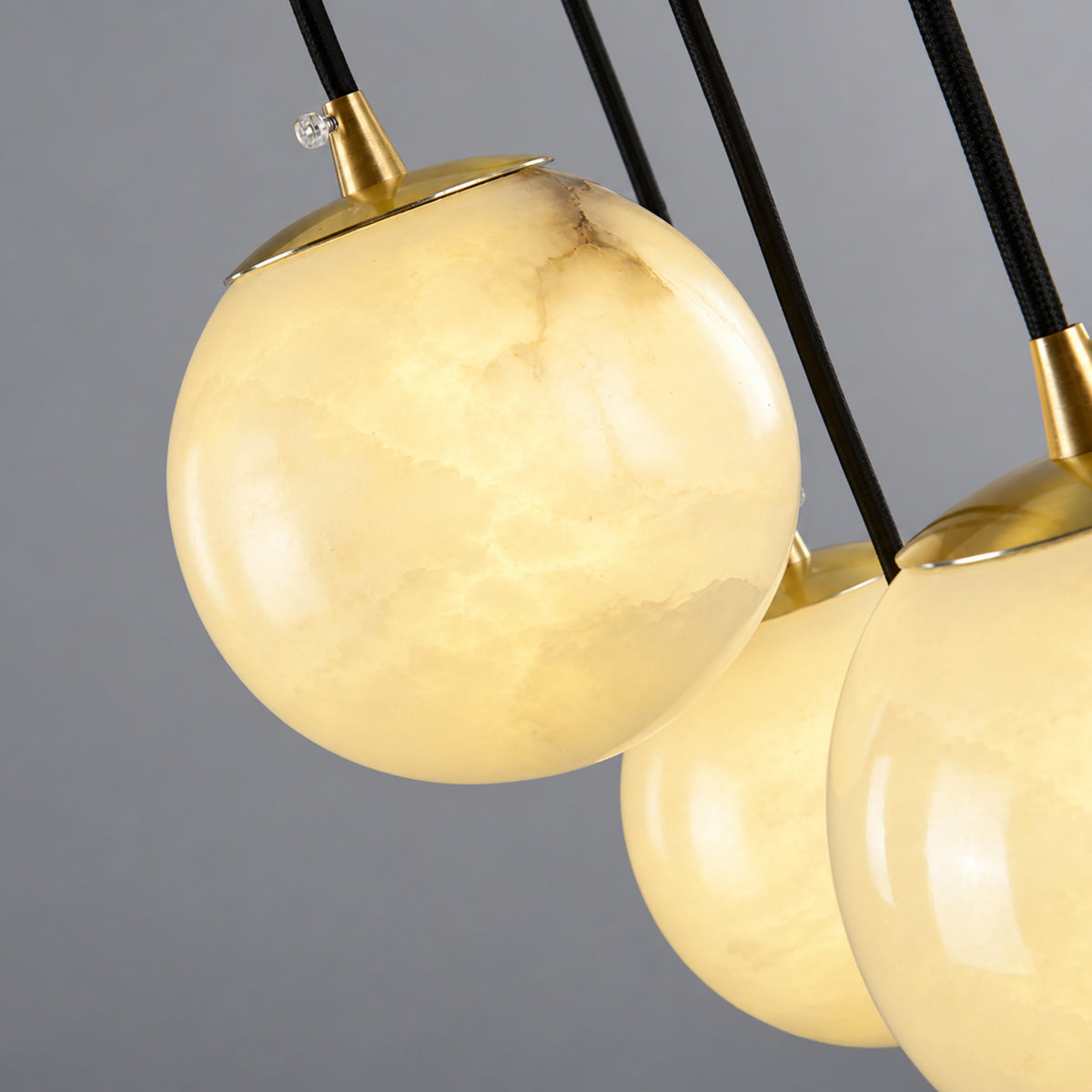 Celestelle Alabaster Globe Cluster Chandelier, 12 cm natural alabaster globe and copper cap detail | CARRA HOME
