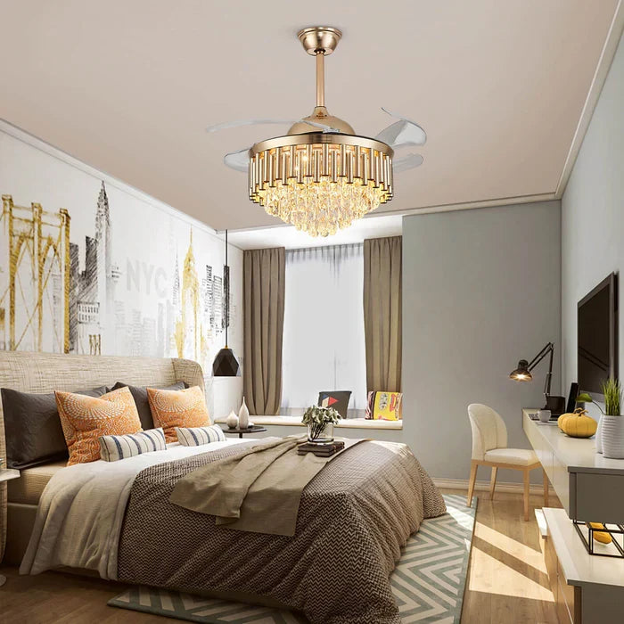 Crownelle Luxury K9 Crystal Retractable Ceiling Fan Chandelier installed in a modern bedroom — hanging above a bed with a cityscape mural, providing ambient lighting with its elegant crystal design
