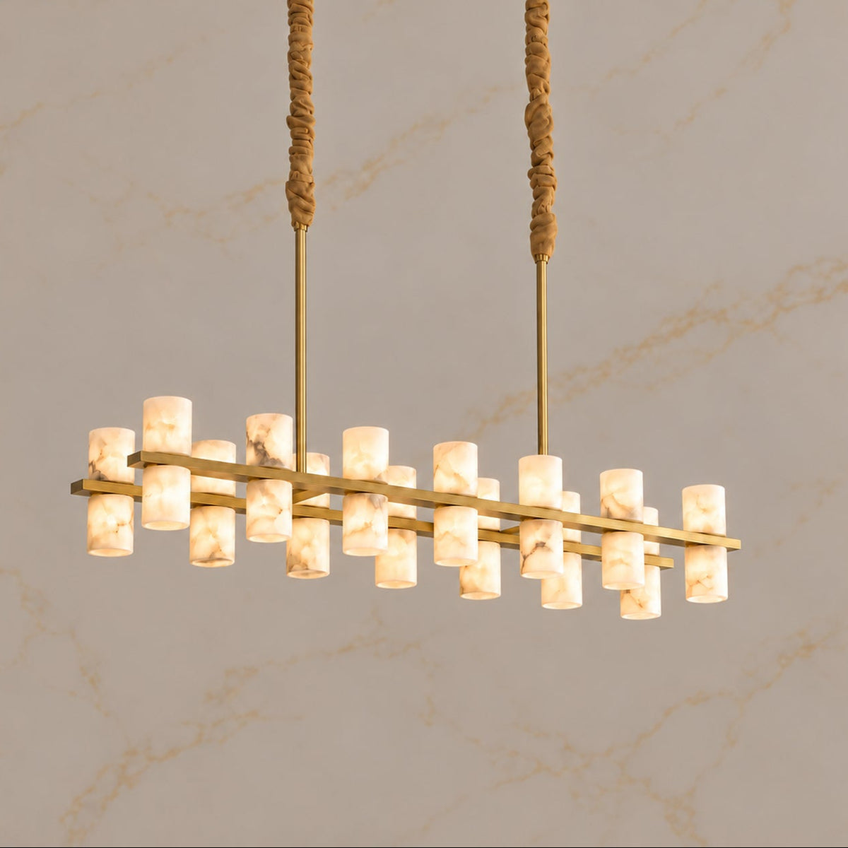 Filari Alabaster Cylinder Linear Chandelier gold 120cm twentytwo lights, light on | CARRA HOME