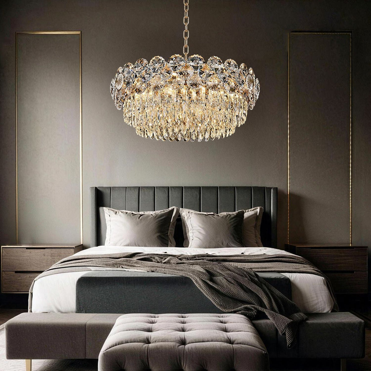 Glacia Modern Luxury Staggered K9 Crystal Flush Mount Chandelier in a bedroom — hanging above a dark upholstered bed with gray bedding, against a dark paneled wall with a landscape painting | Carra Home
