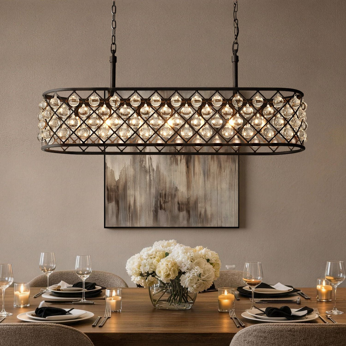 Harlow Modern Industrial Matte Black K9 Crystal Rectangle Chandelier in a dining room — hanging above a wooden table with white flowers, elegant tableware, and a dark paneled wall backdrop | Carra Home