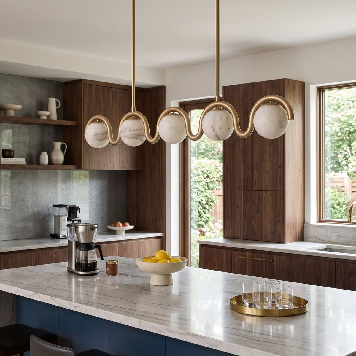 Gold alabaster wave chandelier in an open kitchen | CARRA HOME