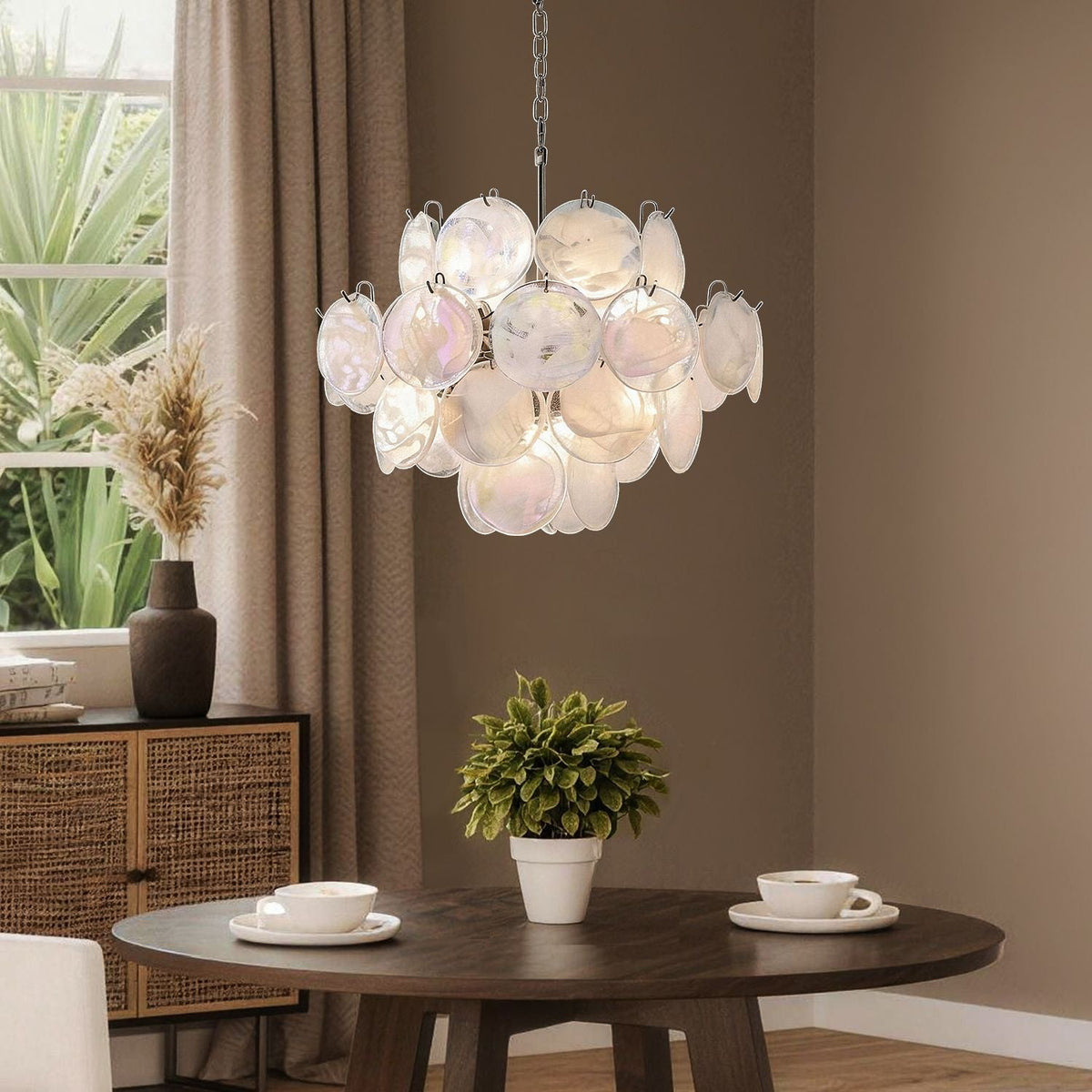 Luna Artistic Nordic Moonlight White Acrylic Petal Three-Color Eye-Care Chandelier casting warm, eye-caring glow over a beautifully set dining table with floral centerpiece and fine dinnerware | Carra Home