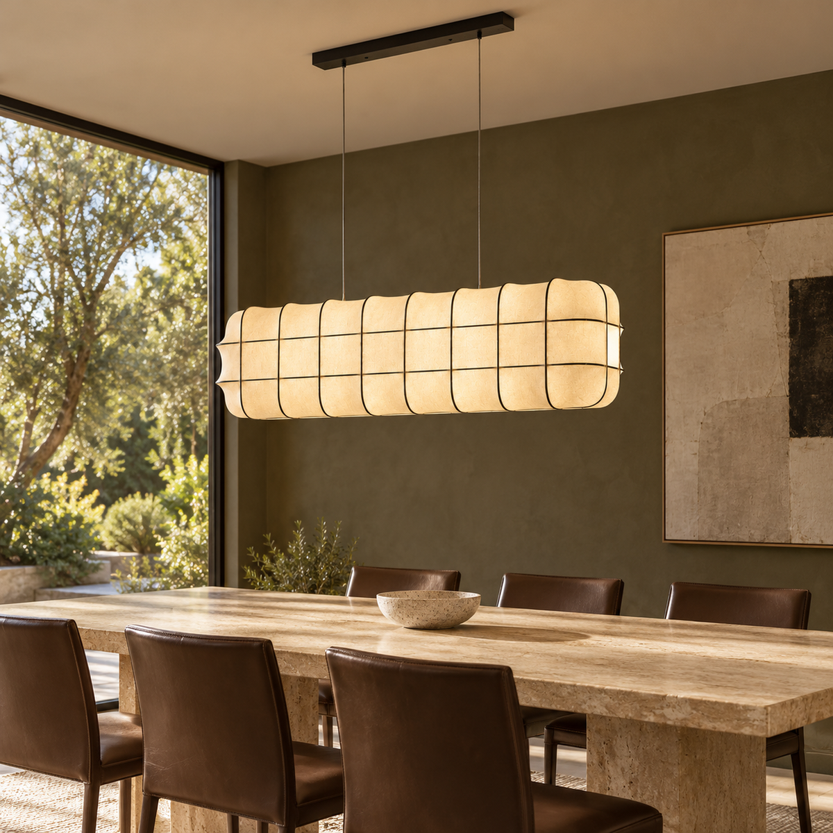 Marlowe fabric lantern chandelier above a travertine dining table | CARRA HOME