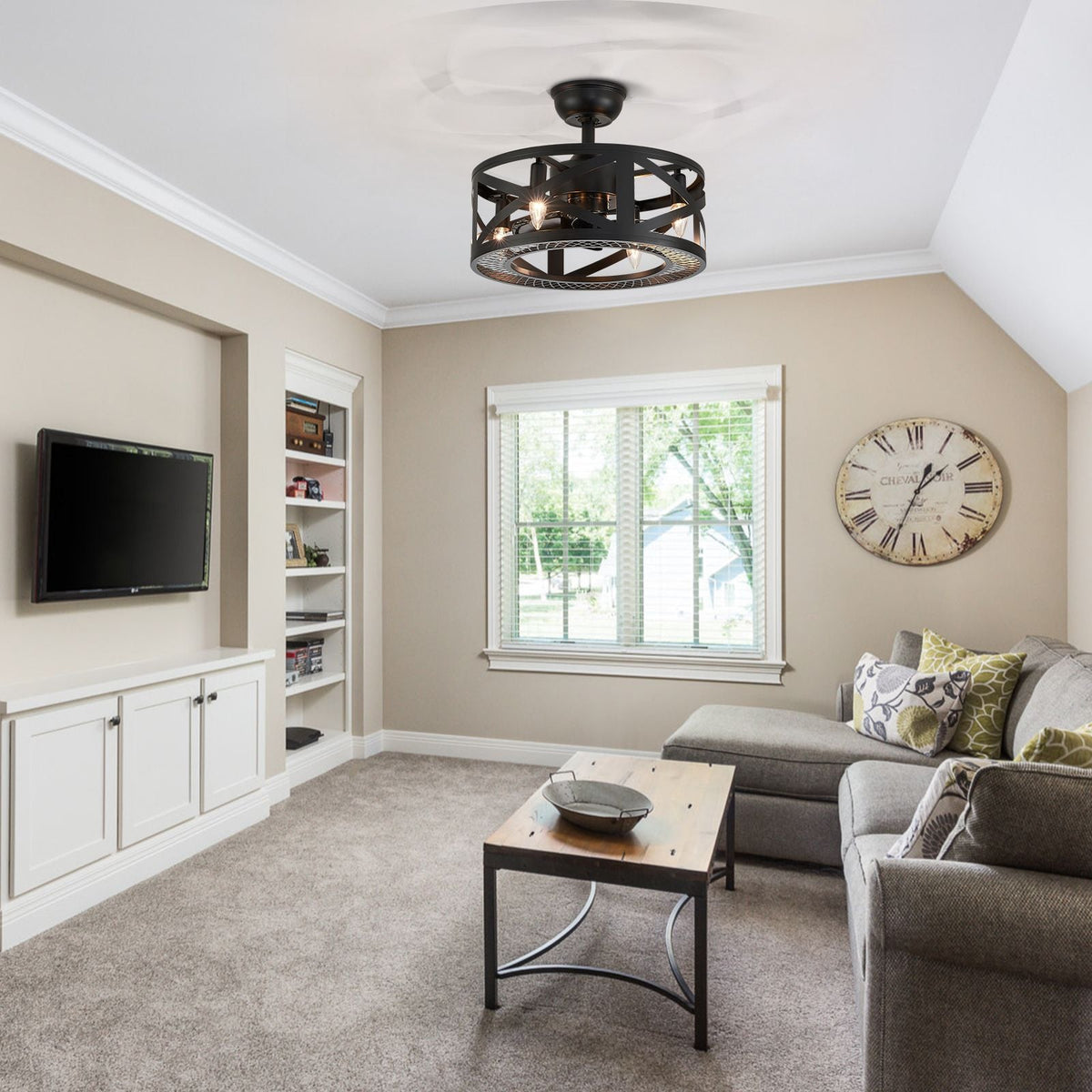 Industrial caged ceiling fan in living room — vaulted ceiling, sectional sofa, wall TV, roman clock, cozy neutral tones | CARRA HOME