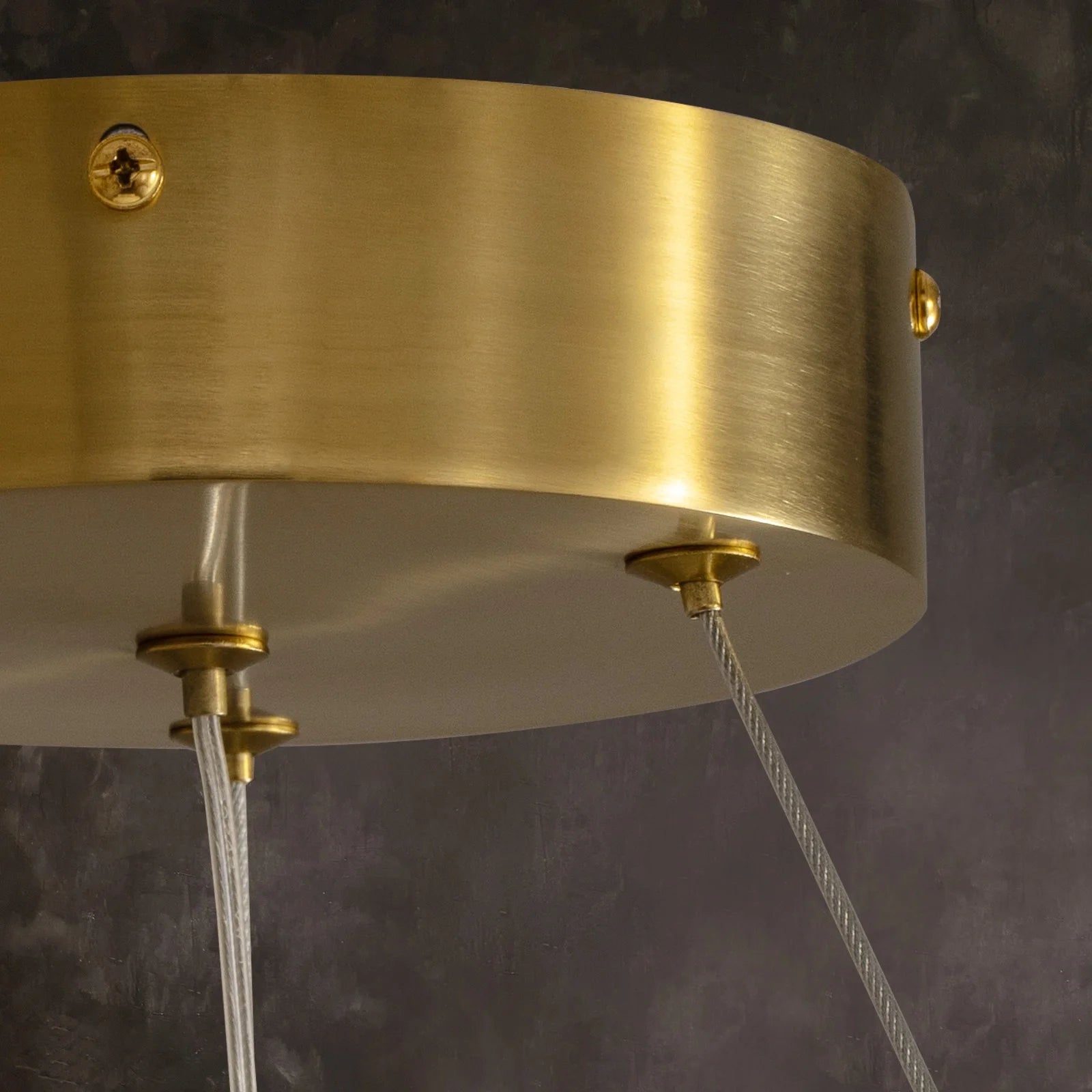 close-up-of-modern-round-alabaster-gold-chandelier-with-circular-gold-frame-and-evenly-spaced-alabaster-panels-emitting-warm-light-carra-home