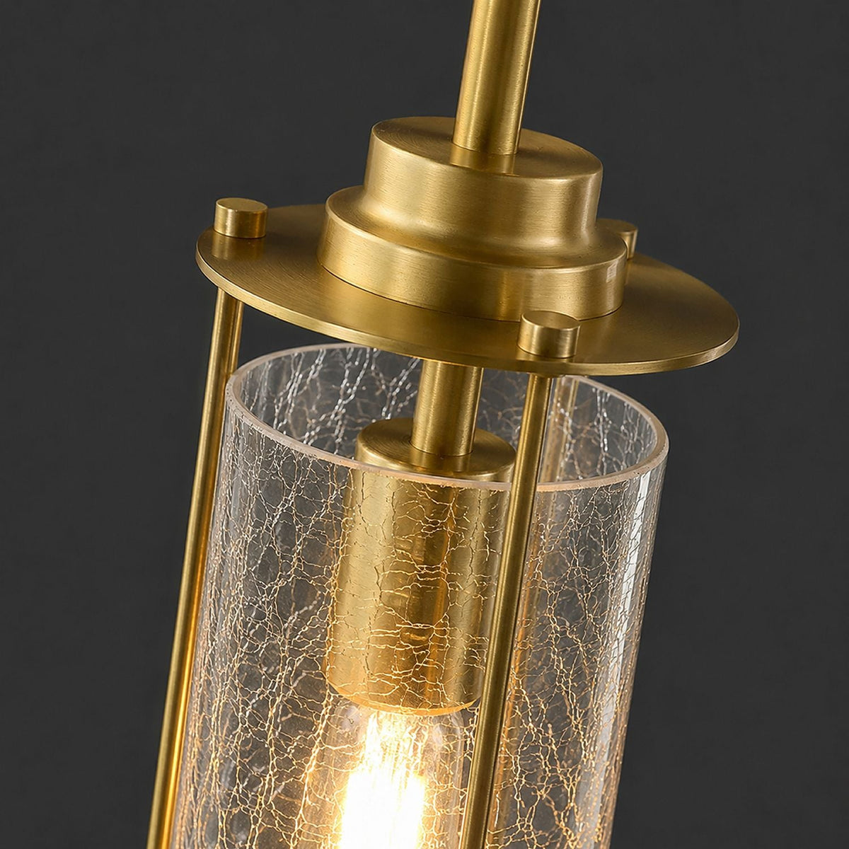 Close-up of Novera Chandelier — hand-blown crackle-textured glass globes, brushed brass stems, exposed filament bulb — showcasing artisan quality and material depth | Carra Home