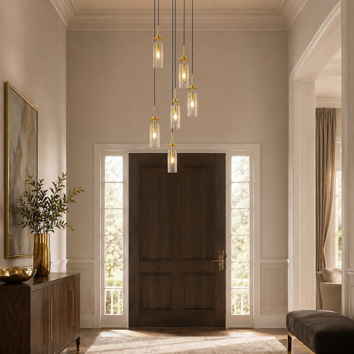 Novera Chandelier in elegant foyer — arched top, dark wood door, oval mirror, polished wood floor — creates a grand welcoming focal point | Carra Home