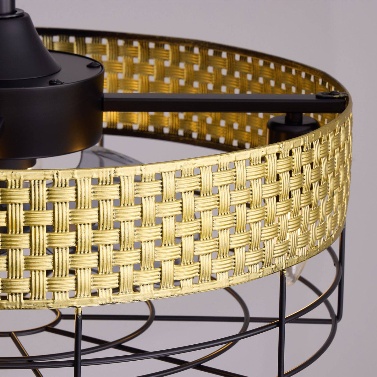 Close-up of hand-woven rattan weave texture — gold woven pattern, square cutout details, boho coastal craftsmanship, metal cage accent | CARRA HOME