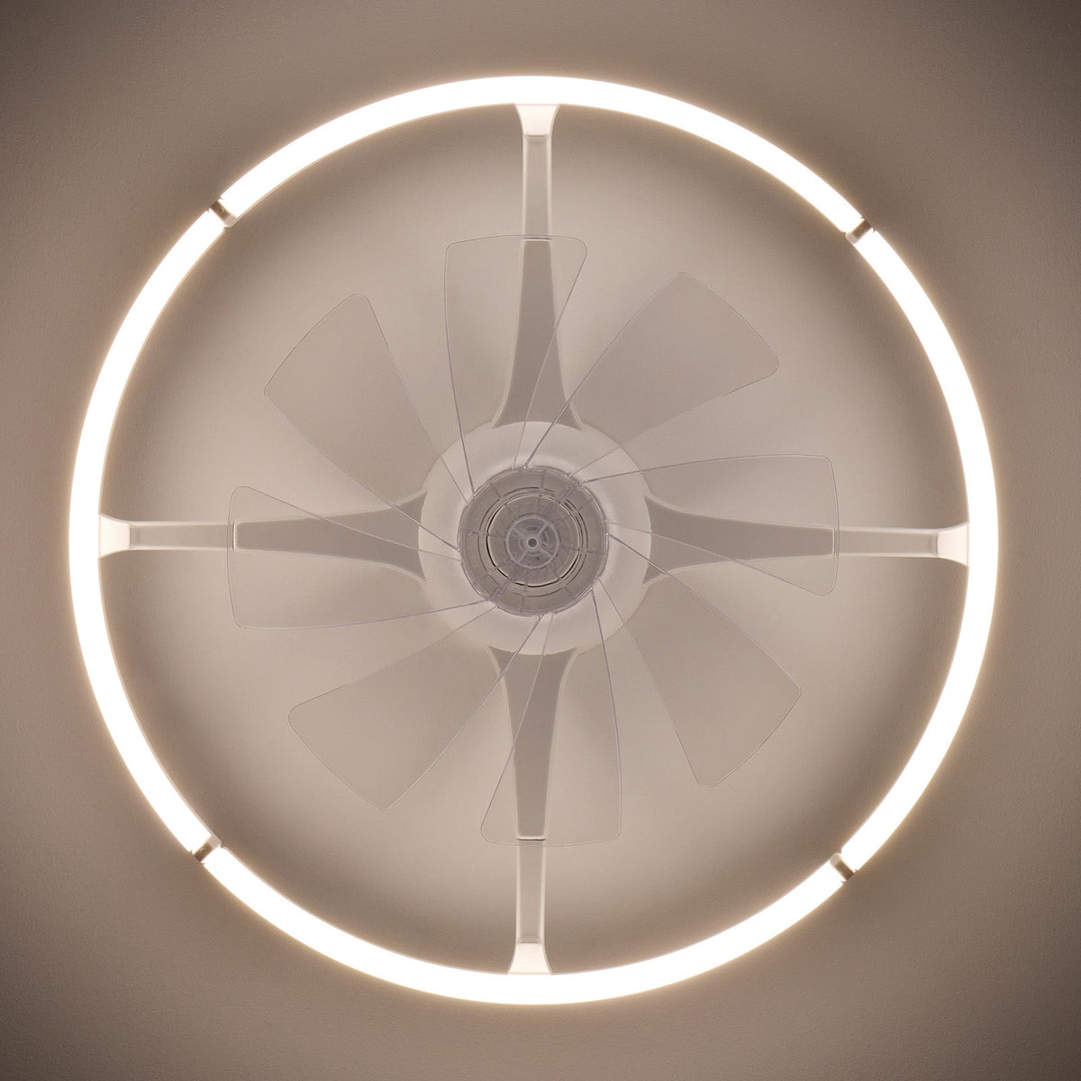 Top-down view of 23.6" white foldable ceiling fan — glowing LED light ring, transparent acrylic blades extended, white round housing, central motor, flush mount ceiling | CARRA HOME