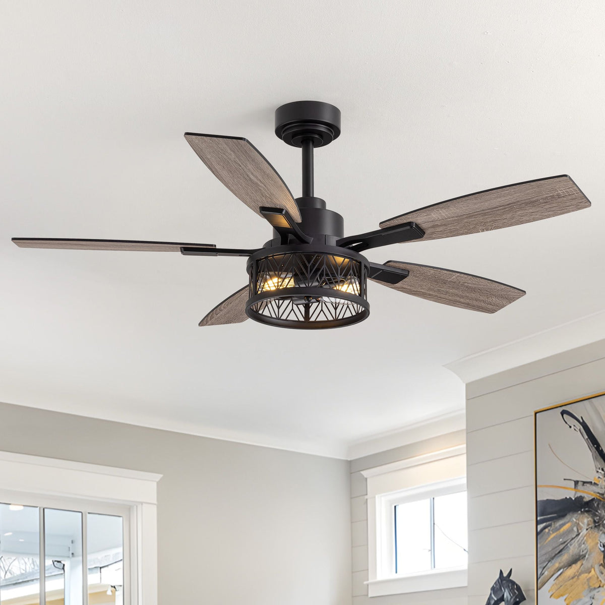 51" Farmhouse Ceiling Fan with LED Light — matte black motor housing, woven cage shade, reversible wood-grain blades, rustic ceiling fan in bright farmhouse interior | CARRA HOME