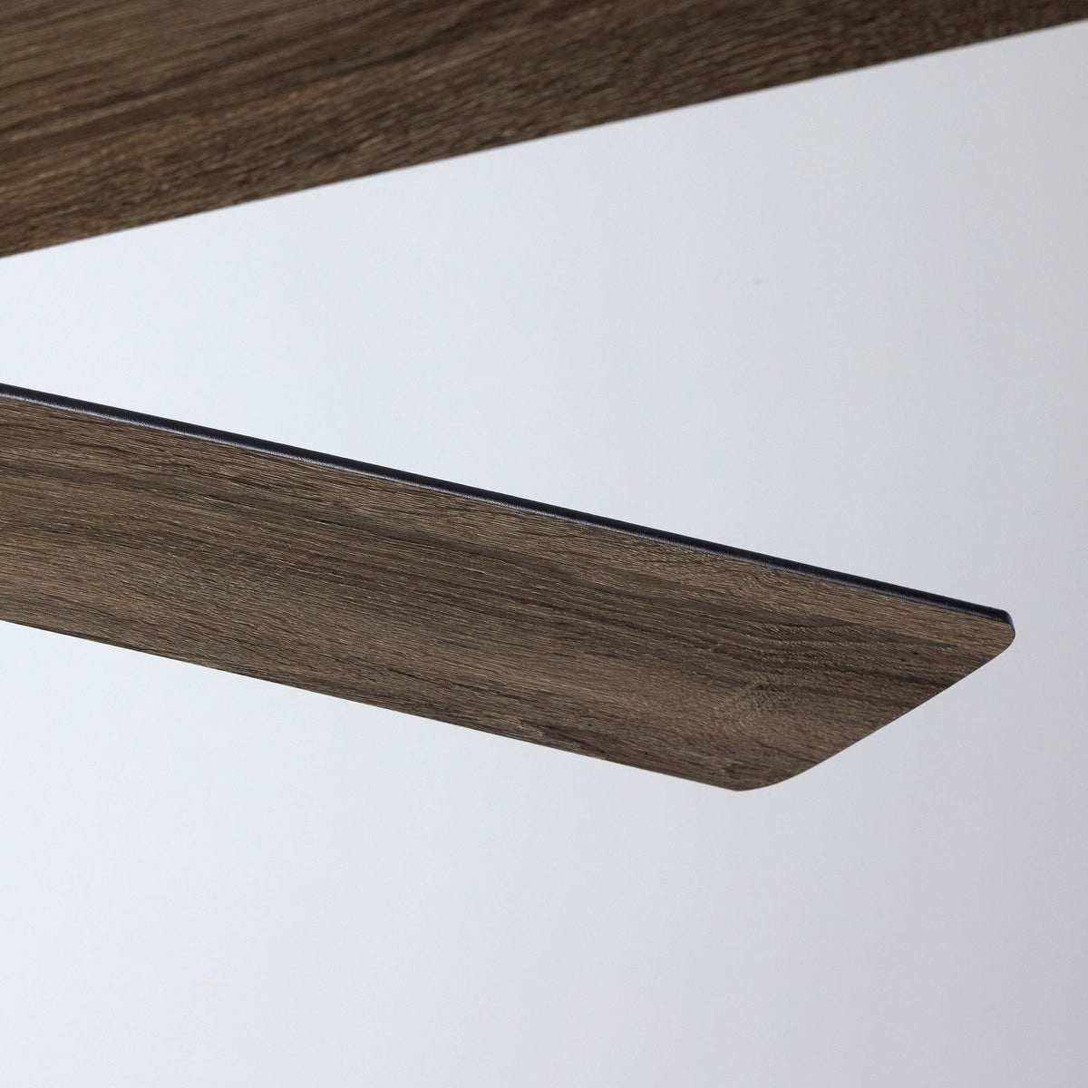 Close-up of reversible fan blade — rich wood grain texture, black edge trim, dual-tone finish, premium craftsmanship detail | CARRA HOME