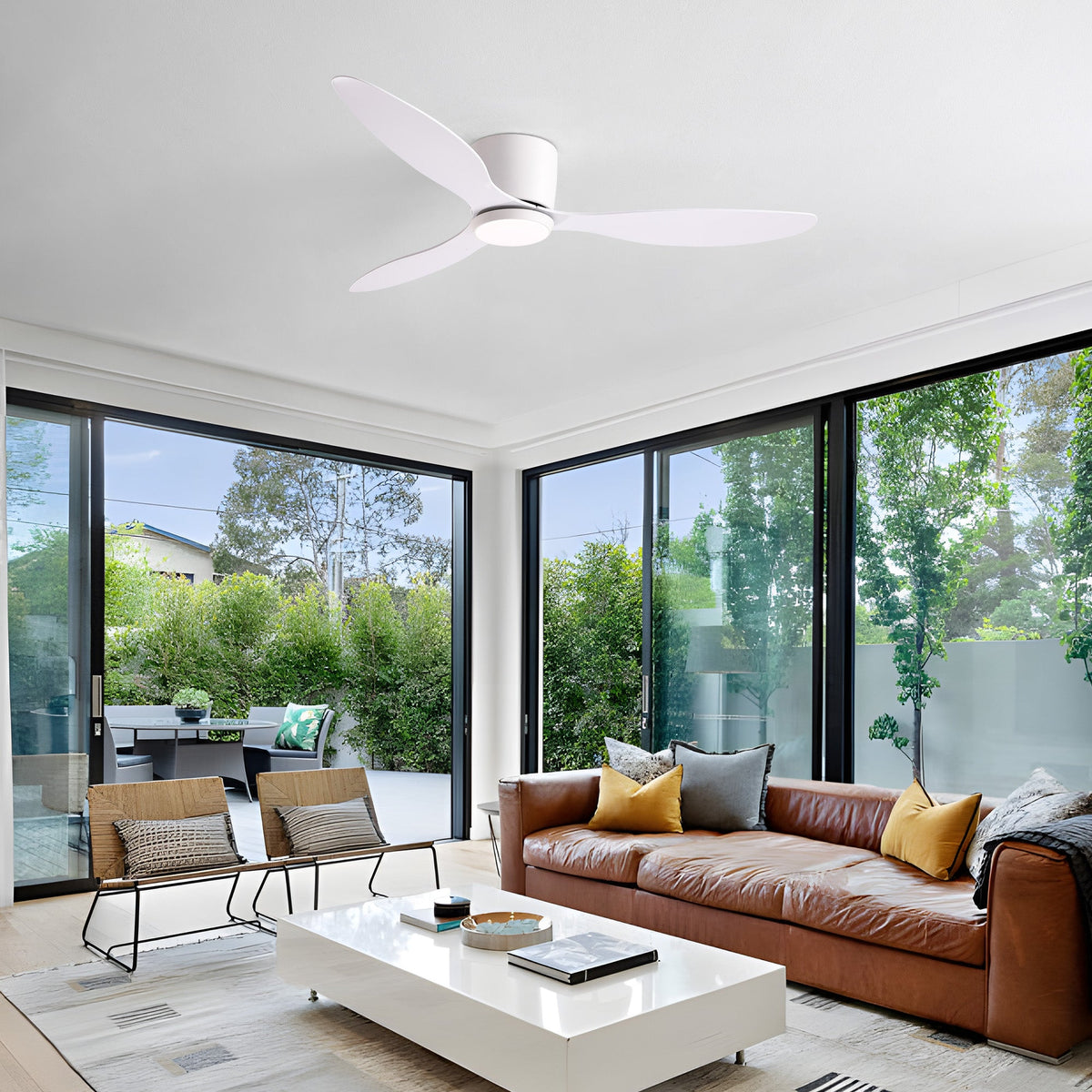 Aeroform Ceiling Fan in cozy minimalist living room — arched mirror, fireplace, leather sofa, warm ambiance with dimmable LED and whisper-quiet fan | CARRA HOME