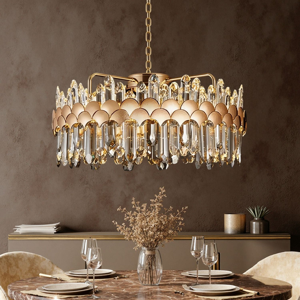 aurelio modern gold k9 crystal round chandelier hanging above dining table in elegant dining room setting | Carra Home
