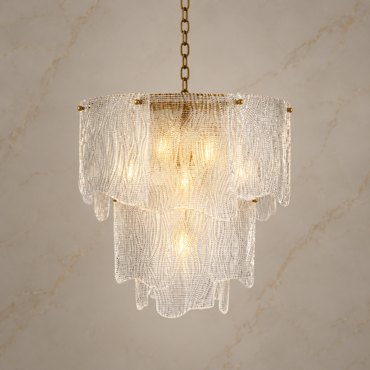 Aurora small clear textured seeded glass chandelier illuminated | CARRA HOME