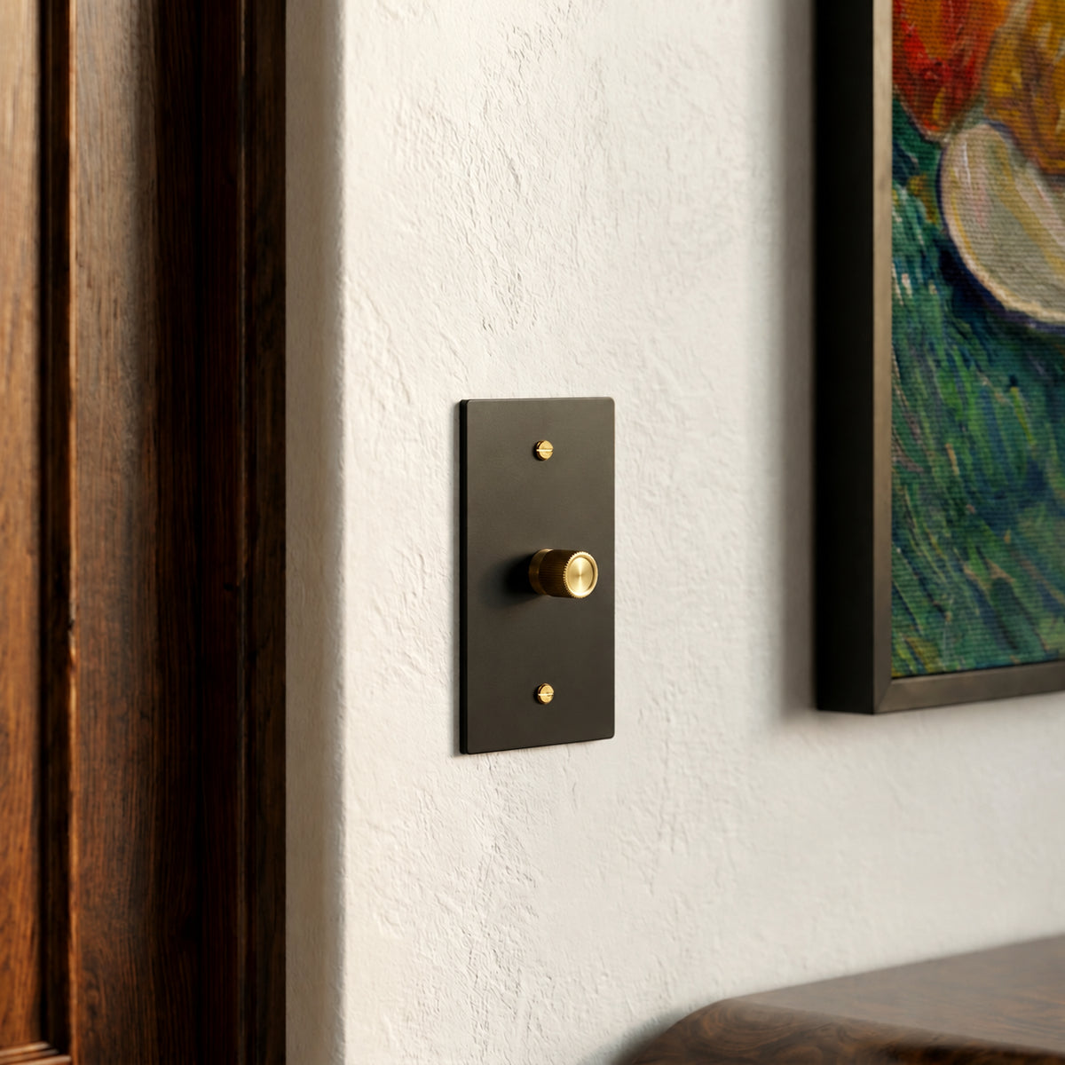 Brass Rotary Dimmer Switch installed in an interior, view 41 — seamless faceplate | CARRA HOME