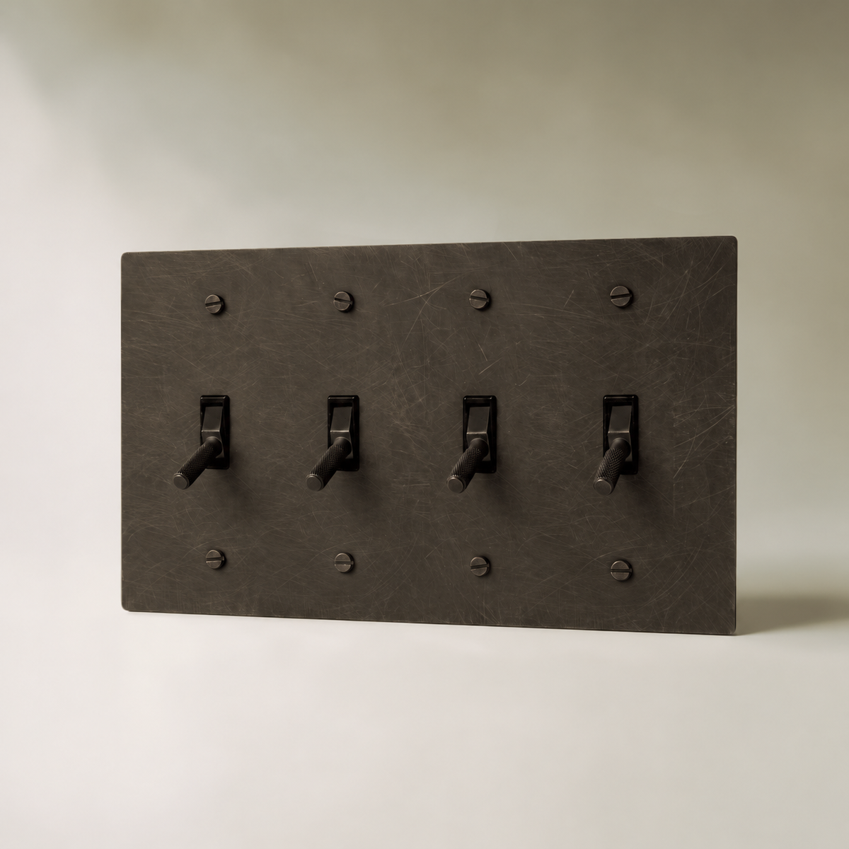Brass Toggle Switch, Bronze with Patina 4 Gang product view — seamless faceplate | CARRA HOME