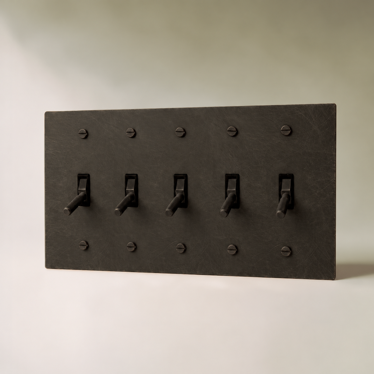Brass Toggle Switch, Bronze with Patina 5 Gang product view — seamless faceplate | CARRA HOME