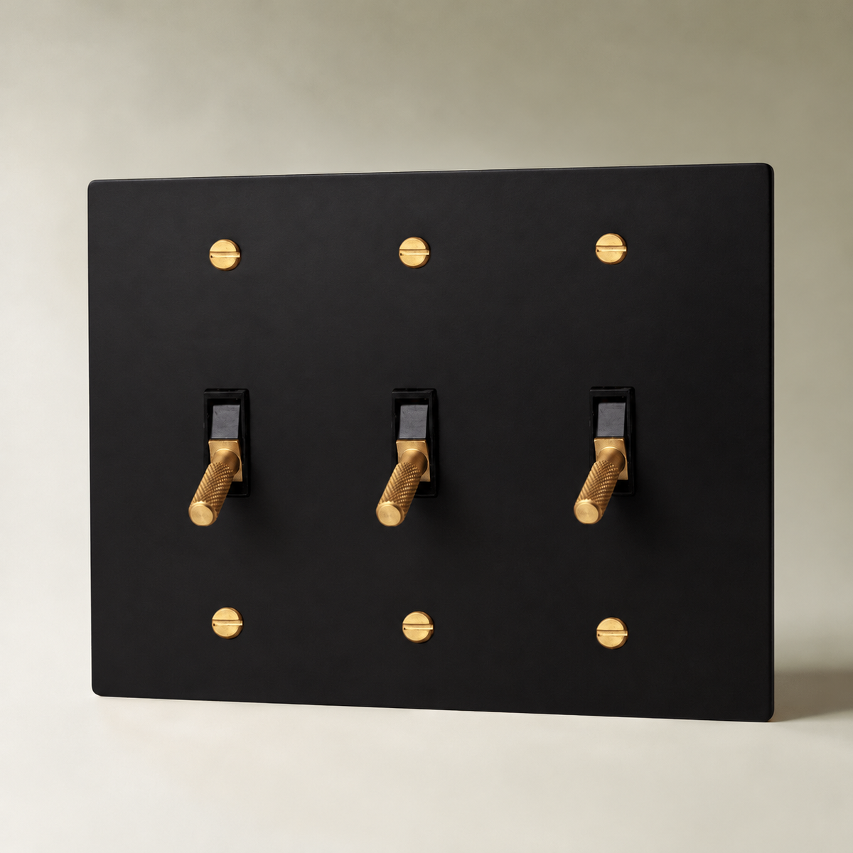 Brass Toggle Switch, Night Black with Brass 3 Gang product view — seamless faceplate | CARRA HOME