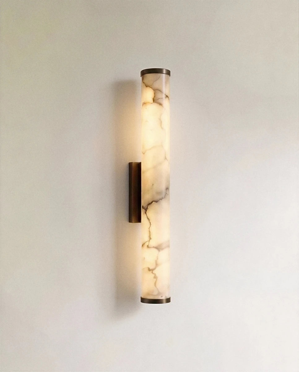 Falynis Alabaster Cylinder Wall Sconce black hardware; source product view | CARRA HOME