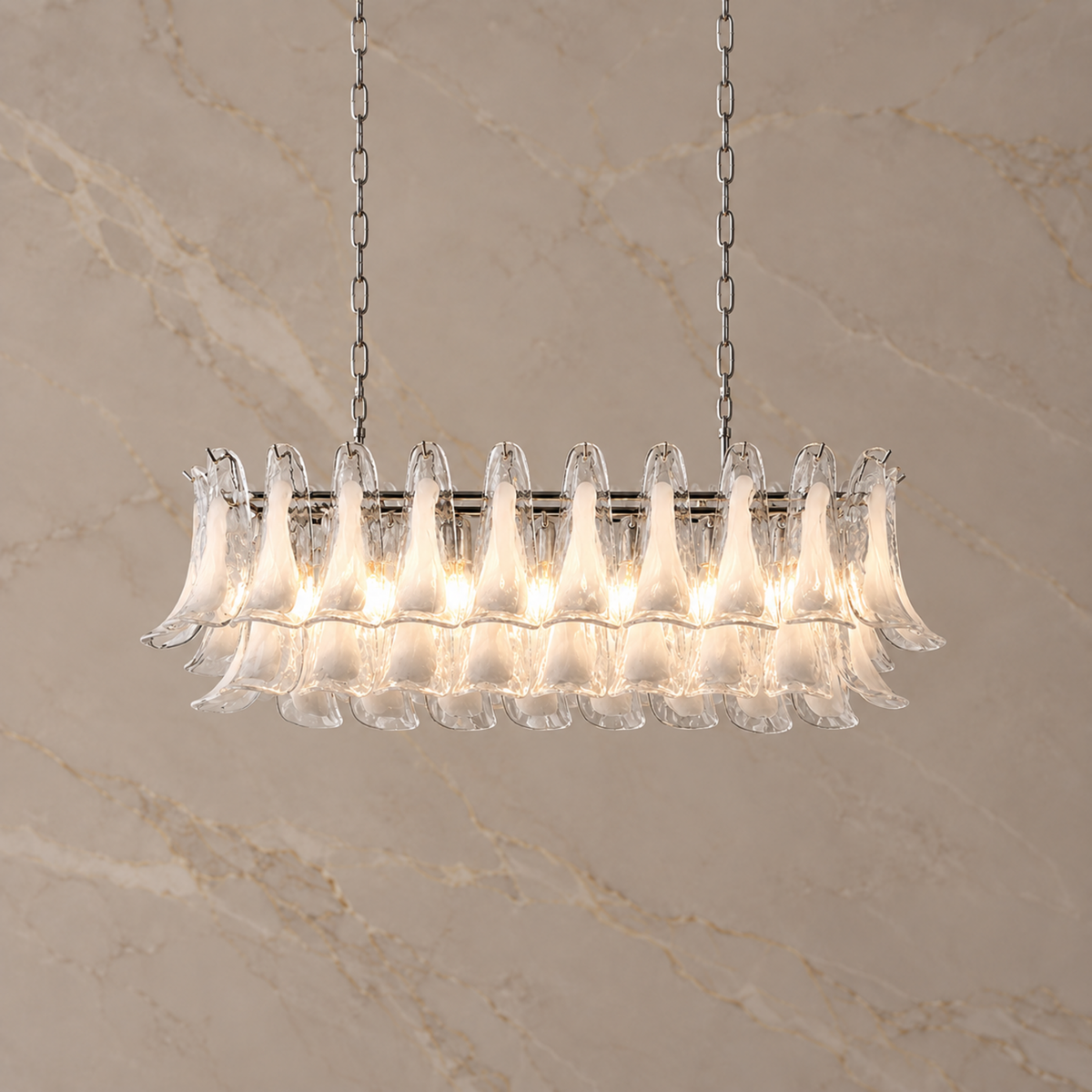 Liora clear glass petal linear chandelier, illuminated | CARRA HOME