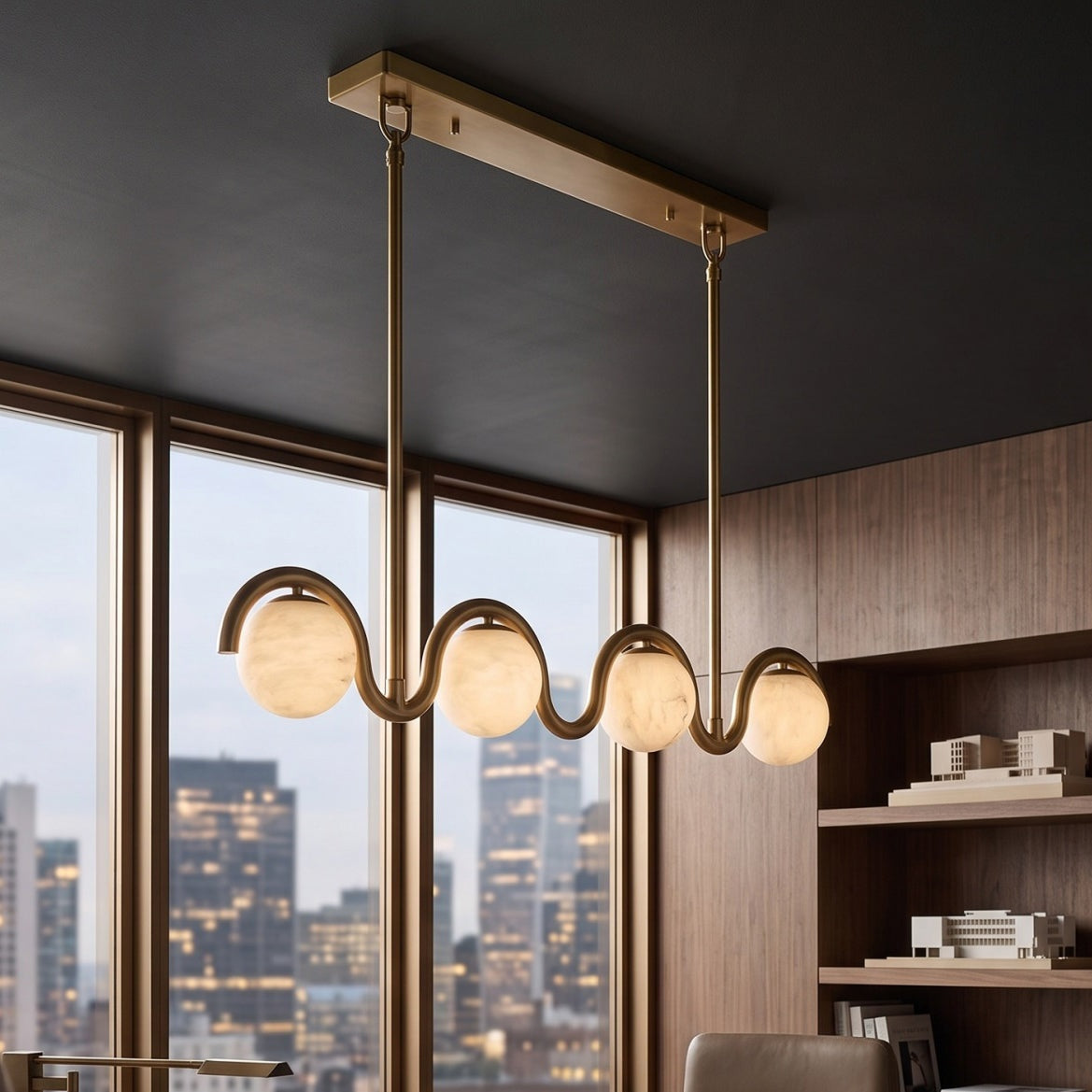 Gold wave chandelier in a kitchen with city views | CARRA HOME