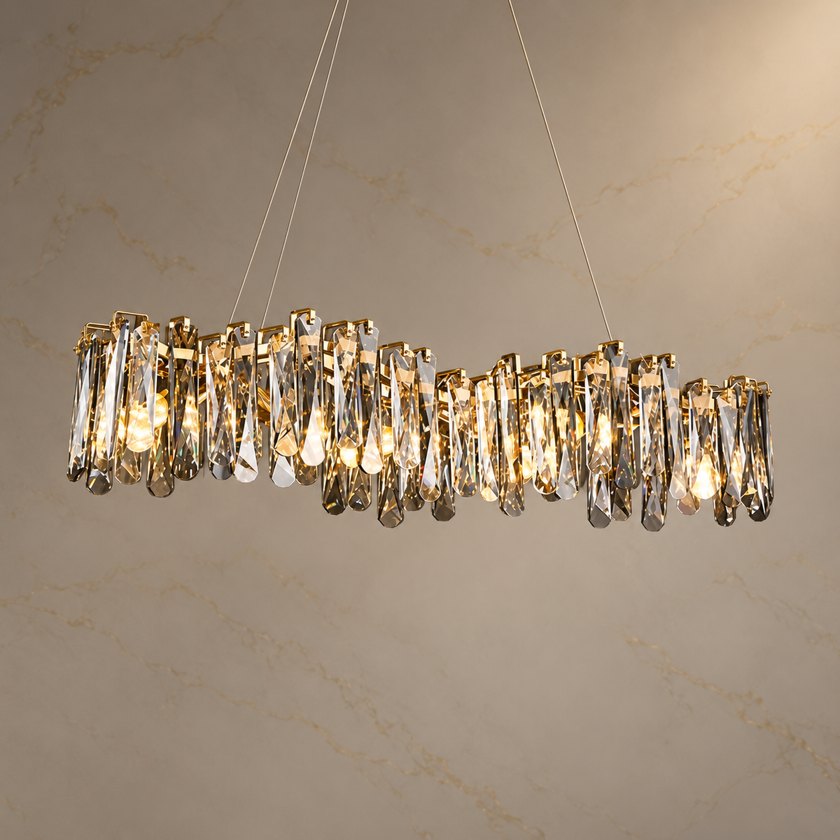 Lioren Gold K9 Crystal Linear Chandelier illuminated