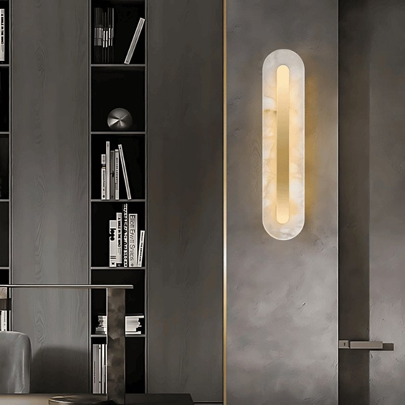 Lofos oval alabaster wall sconce in a contemporary living room | CARRA HOME