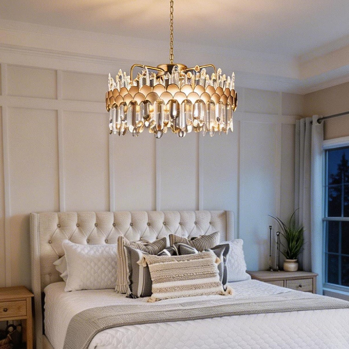 modern gold crystal chandelier used as ceiling light fixture in bedroom with soft warm lighting | Carra Home