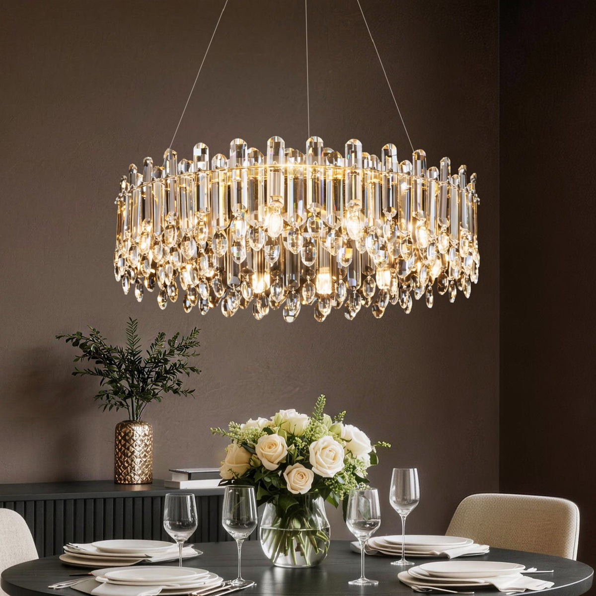 Nova Flux Gold Crystal Round Chandelier above a dining table