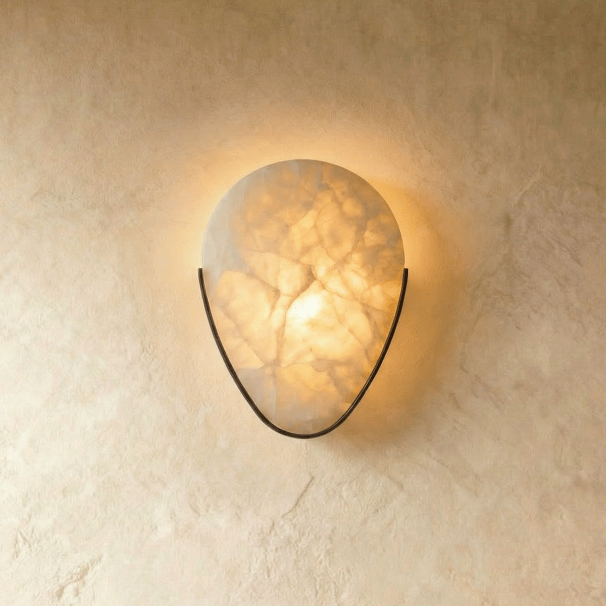 Ritu Alabaster Teardrop Wall Sconce bronze hardware; source product view | CARRA HOME